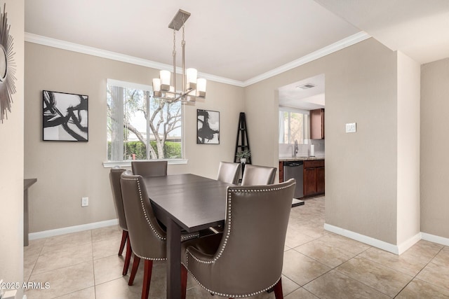 dining space featuring light tile patterned floors, ornamental molding, baseboards, and a chandelier