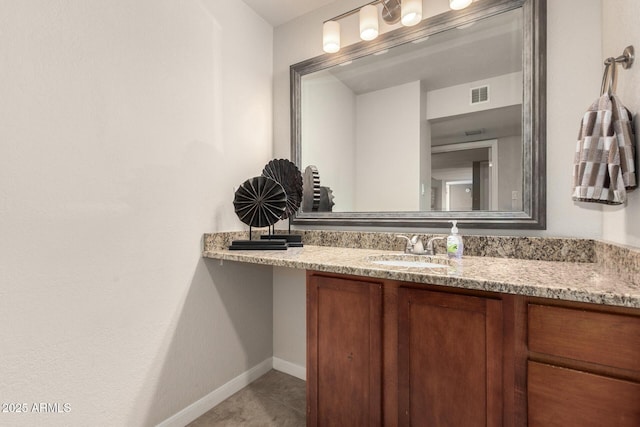 bathroom with baseboards, visible vents, vanity, and tile patterned floors
