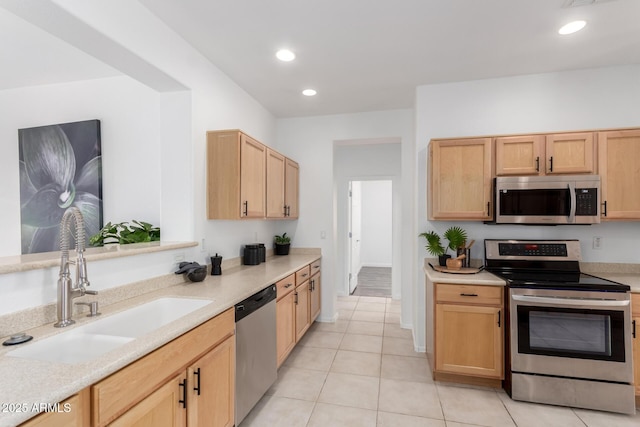 34516 S Pioneer Way, Red Rock, AZ 85145 - kitchen with stainless steel appliances, a sink, light brown cabinets, light countertops, and recessed lighting