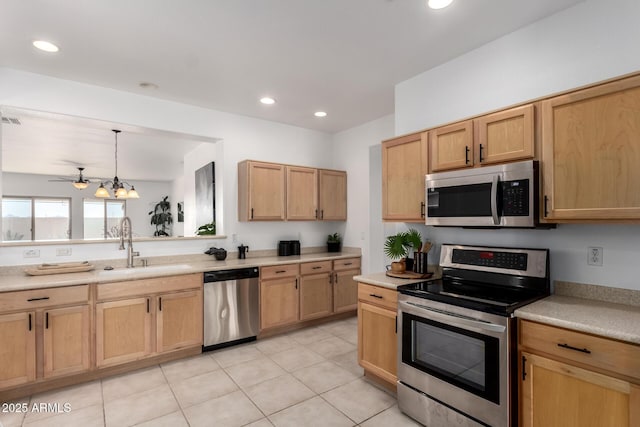 34516 S Pioneer Way, Red Rock, AZ 85145 - kitchen with appliances with stainless steel finishes, a sink, light countertops, light tile patterned floors, and recessed lighting
