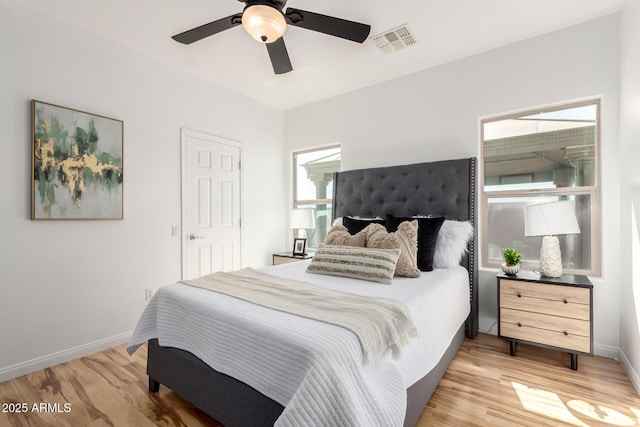 34516 S Pioneer Way, Red Rock, AZ 85145 - bedroom with light wood-type flooring, baseboards, and ceiling fan