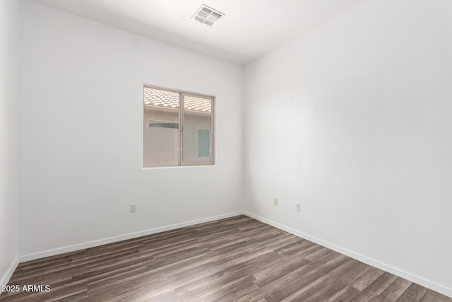 34516 S Pioneer Way, Red Rock, AZ 85145 - unfurnished room with dark wood finished floors and baseboards