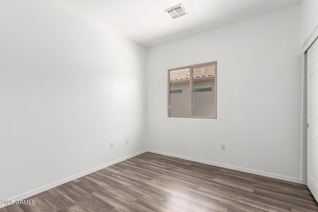 34516 S Pioneer Way, Red Rock, AZ 85145 - empty room featuring wood finished floors and baseboards