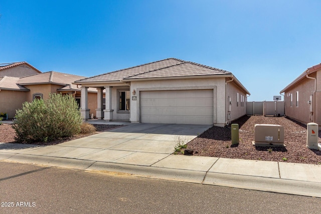34516 S Pioneer Way, Red Rock, AZ 85145 - single story home with a garage, driveway, a tile roof, stucco siding, and fence