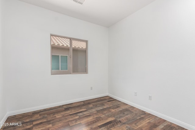 34516 S Pioneer Way, Red Rock, AZ 85145 - spare room with baseboards and dark wood-style floors