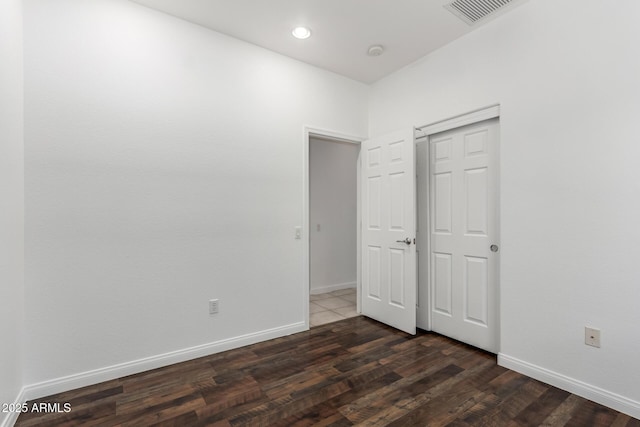 34516 S Pioneer Way, Red Rock, AZ 85145 - unfurnished bedroom with dark wood-type flooring and baseboards