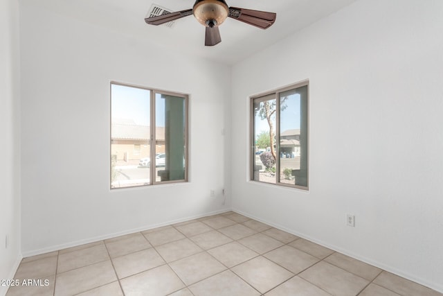 34516 S Pioneer Way, Red Rock, AZ 85145 - empty room with light tile patterned floors and ceiling fan