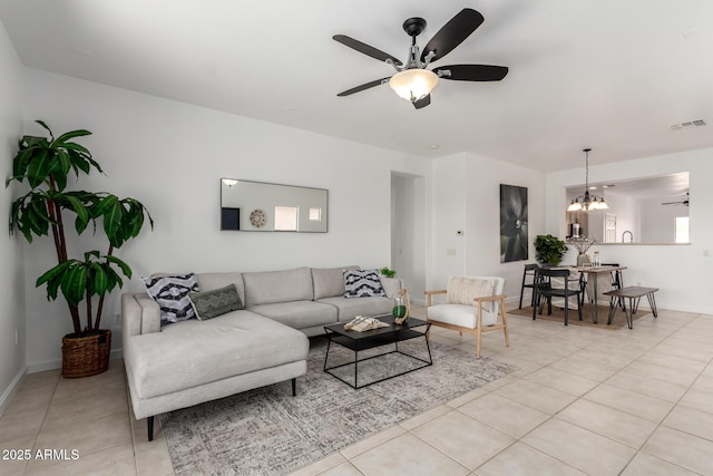 34516 S Pioneer Way, Red Rock, AZ 85145 - living area featuring ceiling fan, light tile patterned flooring, a chandelier, and baseboards