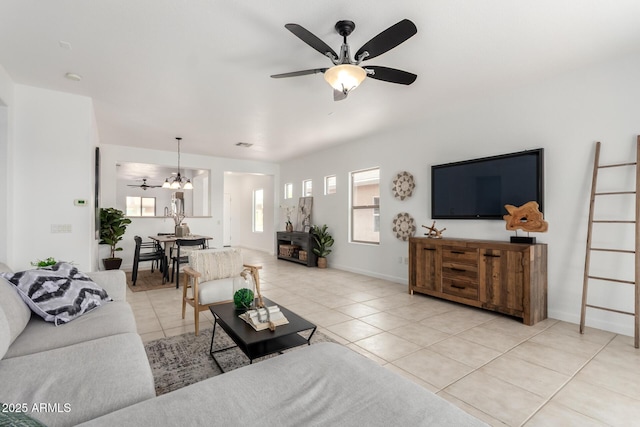 34516 S Pioneer Way, Red Rock, AZ 85145 - living area with light tile patterned flooring, ceiling fan, a chandelier, and baseboards