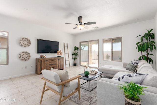 34516 S Pioneer Way, Red Rock, AZ 85145 - living area with ceiling fan, light tile patterned flooring, and baseboards