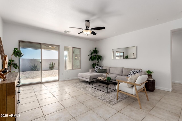 34516 S Pioneer Way, Red Rock, AZ 85145 - living area featuring light tile patterned flooring, a ceiling fan, and baseboards