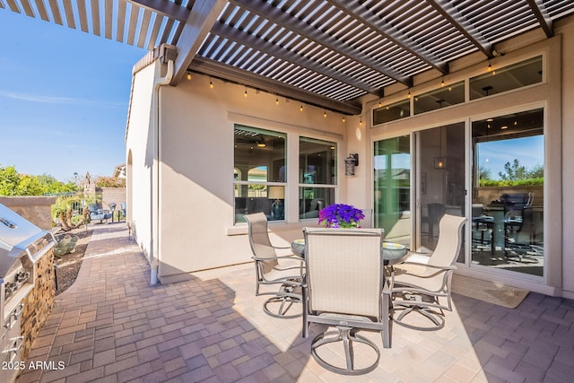 view of patio with a pergola and outdoor dining area