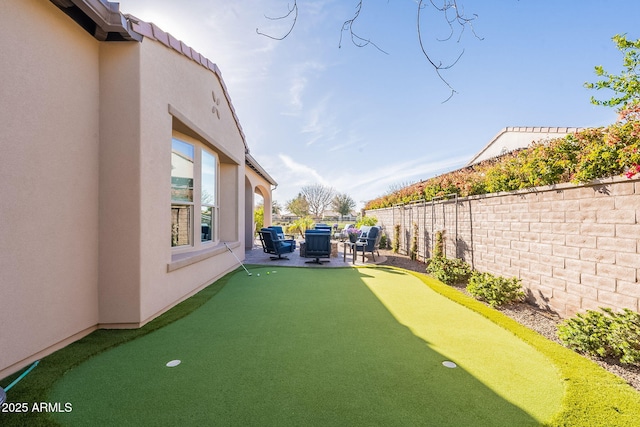 view of yard with a patio area and a fenced backyard