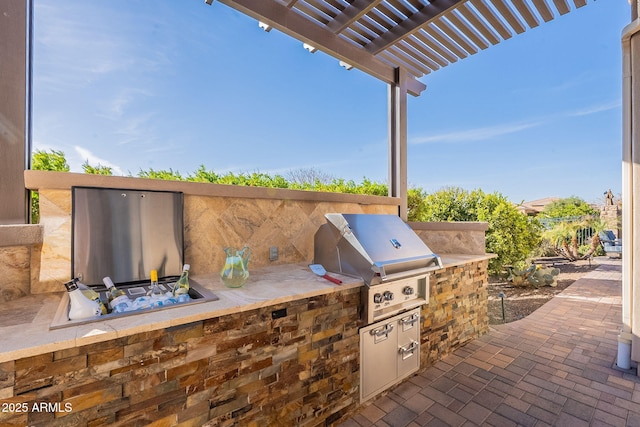 view of patio / terrace featuring area for grilling and a pergola