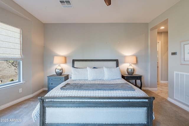 bedroom featuring visible vents, carpet flooring, and baseboards