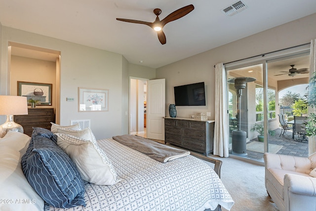 bedroom featuring visible vents, light carpet, access to exterior, and a ceiling fan