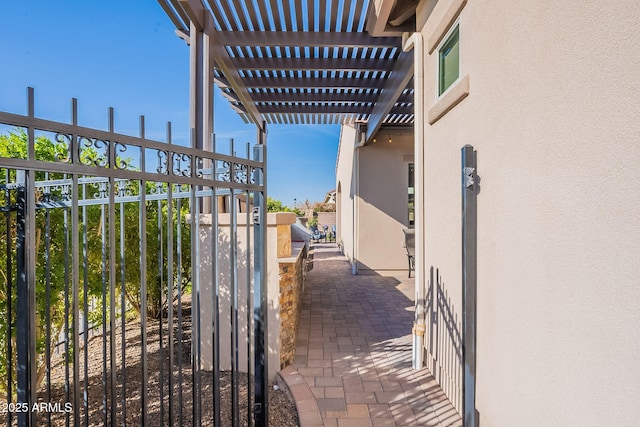 view of gate featuring a pergola