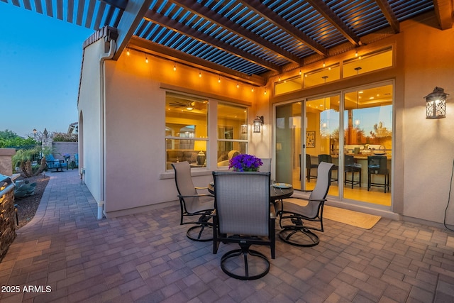 view of patio with outdoor dining space and a pergola