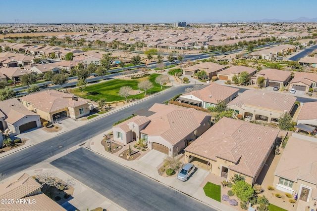 birds eye view of property with a residential view