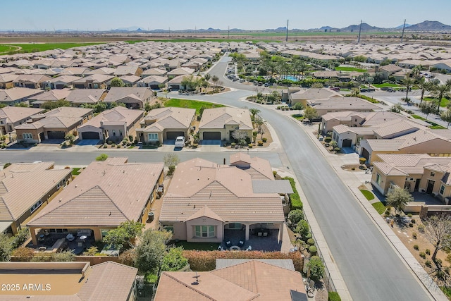 birds eye view of property with a mountain view and a residential view