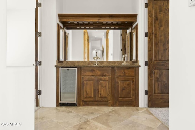 bathroom featuring wine cooler and vanity