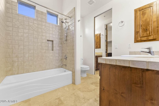 full bath with tub / shower combination, visible vents, toilet, and vanity