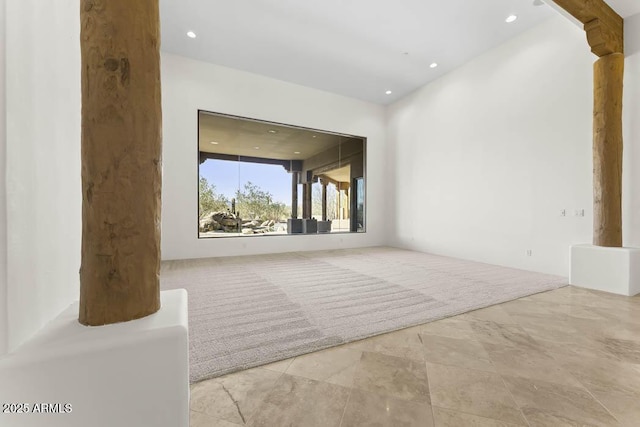 empty room featuring recessed lighting and ornate columns