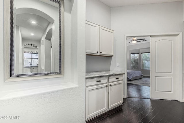 2330 E Stephens Pl, Chandler, AZ 85225 - hall featuring dark wood finished floors, arched walkways, and a sink