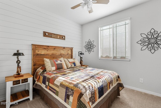 carpeted bedroom with baseboards and ceiling fan
