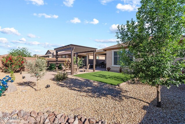 back of house with a pergola, fence, a patio area, a yard, and stucco siding