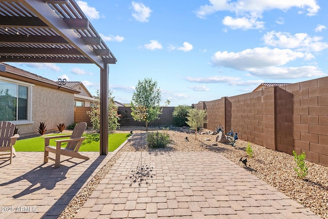 view of patio / terrace with a pergola and a fenced backyard