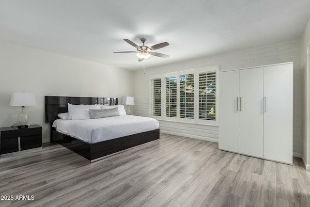 bedroom featuring light hardwood / wood-style flooring and ceiling fan