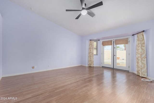 spare room with ceiling fan, light hardwood / wood-style floors, and lofted ceiling