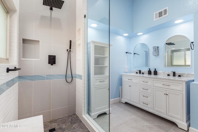 bathroom featuring vanity, walk in shower, and tile walls