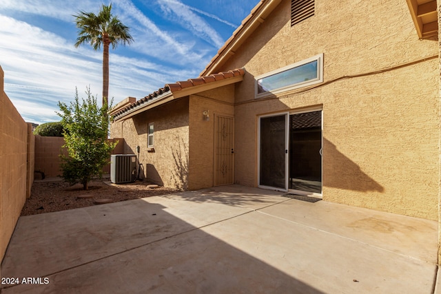 back of house featuring central air condition unit and a patio area