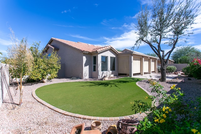 rear view of property with a yard