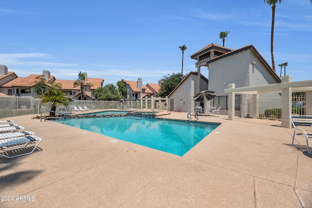 view of swimming pool with a patio