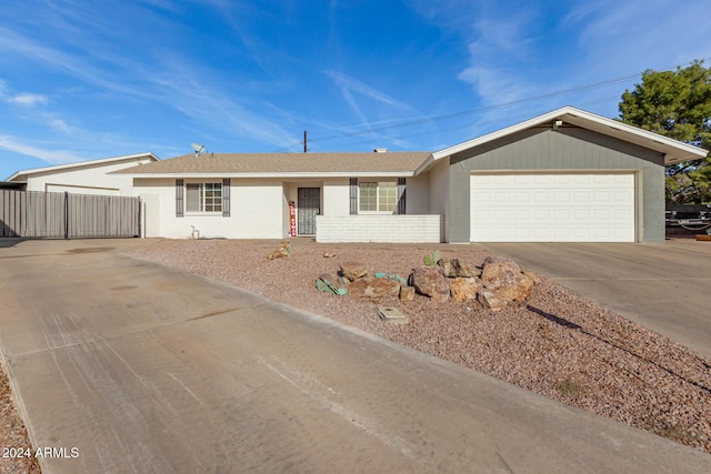 ranch-style home with a garage