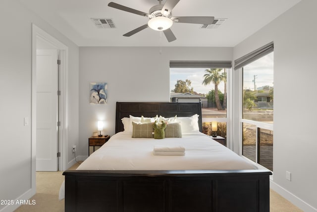 6450 E Vernon Ave, Scottsdale, AZ 85257 - bedroom featuring light carpet, baseboards, and a ceiling fan
