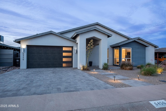 6450 E Vernon Ave, Scottsdale, AZ 85257 - view of front of home with driveway, a garage, and stucco siding