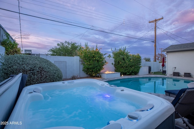 6450 E Vernon Ave, Scottsdale, AZ 85257 - pool at dusk with a hot tub and a fenced backyard
