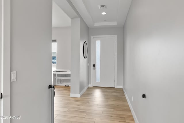 6450 E Vernon Ave, Scottsdale, AZ 85257 - entrance foyer with baseboards, light wood-type flooring, a tray ceiling, and recessed lighting