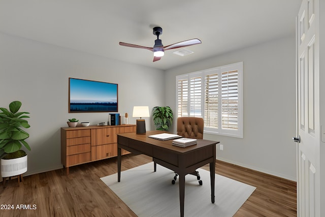 office space with ceiling fan and dark hardwood / wood-style flooring