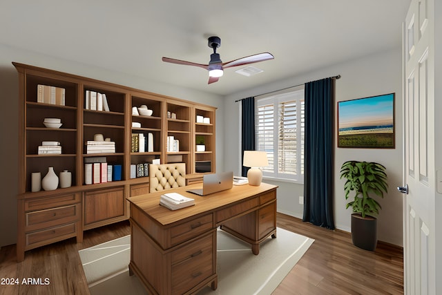 office space with ceiling fan and dark hardwood / wood-style floors