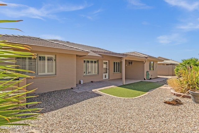 back of house featuring a patio