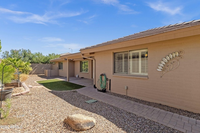 back of property with a patio