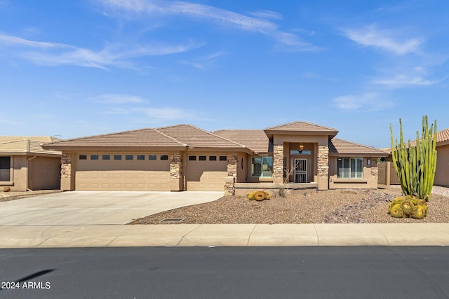 prairie-style house featuring a garage