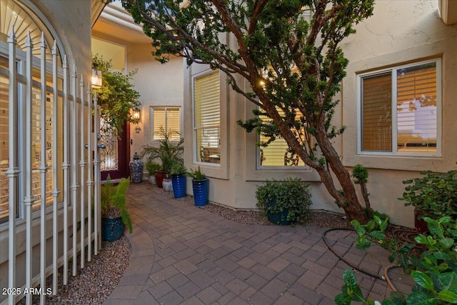 exterior space featuring a patio and stucco siding