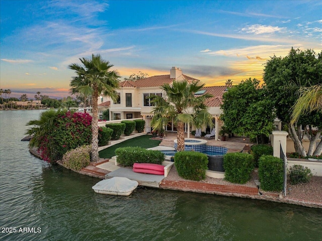 view of home's community with a water view