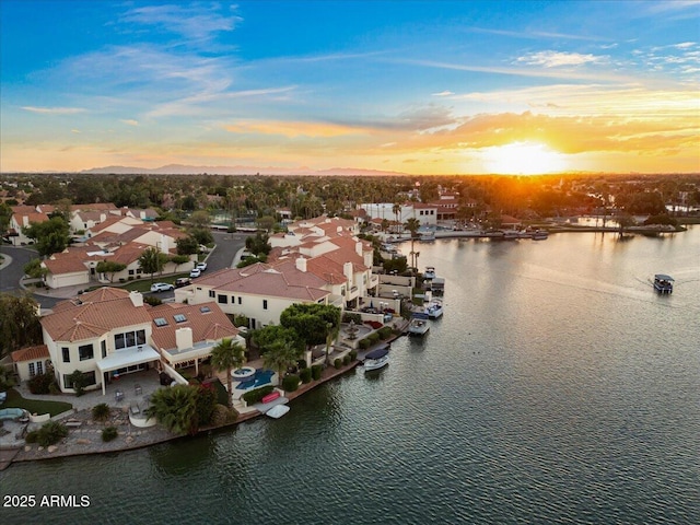 aerial view featuring a water view and a residential view